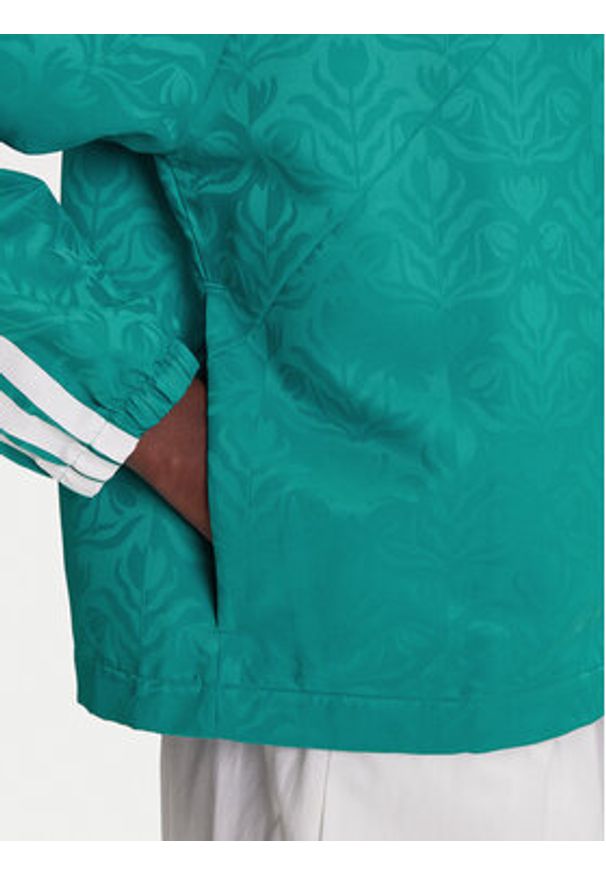 Adidas - adidas Kurtka przejściowa Tiro x Common Goal Coaches JL9204 Turkusowy Loose Fit. Kolor: turkusowy. Materiał: syntetyk