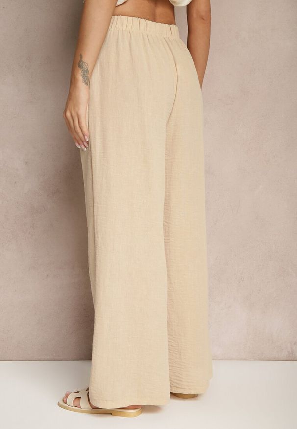 Renee - Beżowe Spodnie Palazzo o Szerokim Kroju High Waist Ollevia. Okazja: na co dzień, na spotkanie biznesowe. Stan: podwyższony. Kolor: beżowy. Materiał: jedwab. Wzór: aplikacja. Styl: biznesowy, casual, elegancki