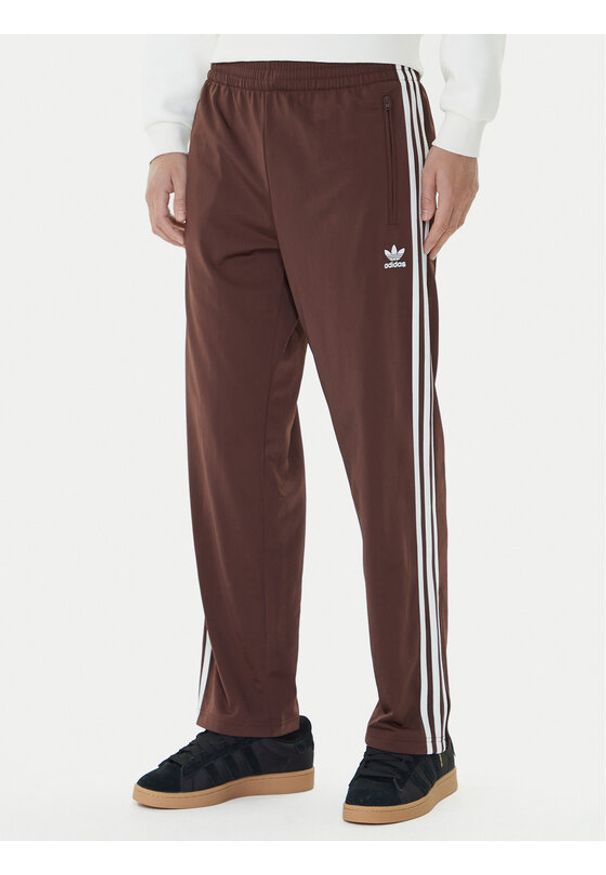 Adidas - adidas Spodnie dresowe adicolor Classics Firebird KA0482 Brązowy Regular Fit. Kolor: brązowy. Materiał: syntetyk