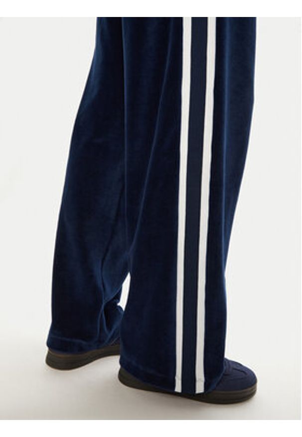 Tommy Jeans Spodnie dresowe Velvet DW0DW20542 Niebieski Regular Fit. Kolor: niebieski. Materiał: bawełna