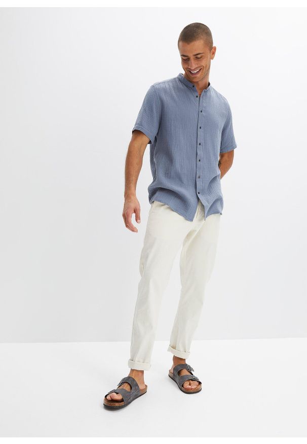 bonprix - Koszula muślinowa z krótkim rękawem. Typ kołnierza: kołnierzyk stójkowy. Kolor: niebieski. Długość rękawa: krótki rękaw. Długość: krótkie