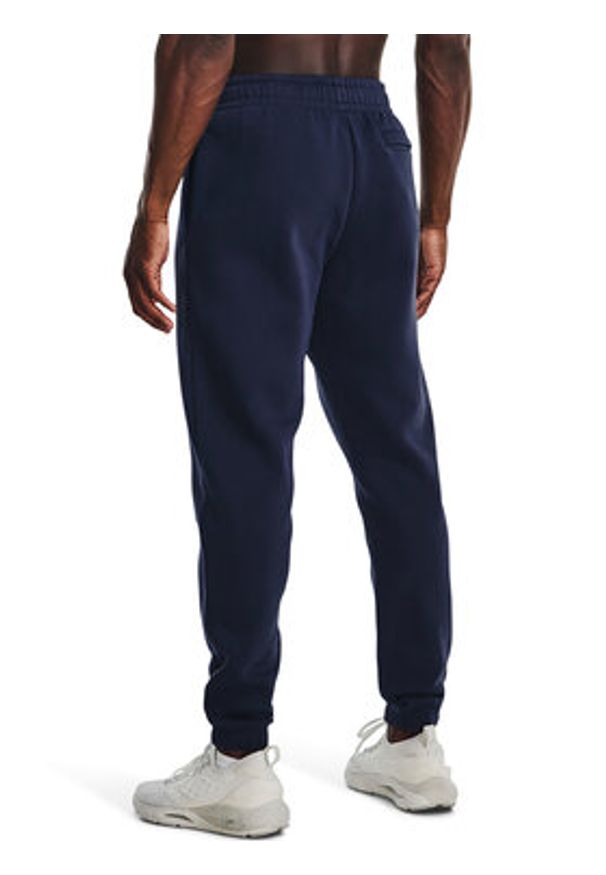 Under Armour Spodnie dresowe UA Essential Fleece Jogger 1373882 Granatowy Regular Fit. Kolor: niebieski. Materiał: bawełna, dresówka