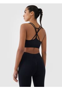 4f - 4F Biustonosz treningowy z niskim wsparciem - czarny XS/S. Kolor: czarny. Materiał: elastan, materiał, włókno, dzianina, jersey, syntetyk. Rodzaj stanika: wyciągane miseczki. Wzór: ze splotem, gładki, jednolity. Sport: fitness, joga i pilates #1