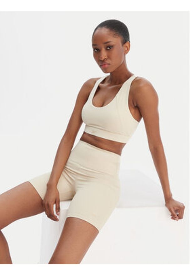 Reebok Biustonosz sportowy Reebok x Ewa Chodakowska Ela RK25615CCW Beżowy. Kolor: beżowy. Materiał: syntetyk