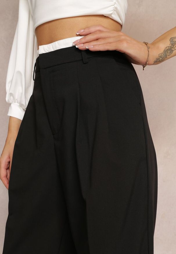 Renee - Czarne Spodnie z Szerokimi Nogawkami w Kant Kavina. Okazja: na co dzień. Stan: podwyższony. Kolor: czarny. Materiał: wiskoza. Styl: elegancki, casual, klasyczny