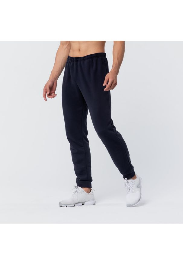 DOMYOS - Spodnie dresowe męskie Domyos Gym & Pilates 100. Kolor: niebieski. Materiał: bawełna, materiał, poliester. Wzór: ze splotem. Sport: joga i pilates