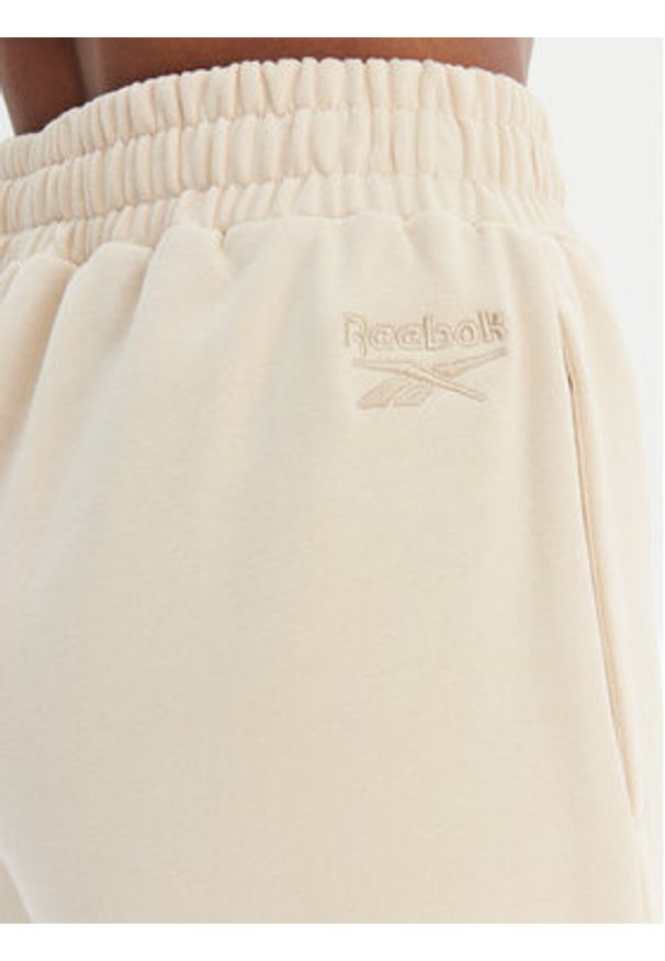 Reebok Spodnie dresowe Reebok x Ewa Chodakowska RK25621CCW Beżowy Relaxed Fit. Kolor: beżowy. Materiał: syntetyk