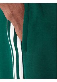 Adidas - adidas Spodnie dresowe adicolor Spacer Track KD4088 Zielony Baggy Fit. Kolor: zielony. Materiał: bawełna. Sport: turystyka piesza #3