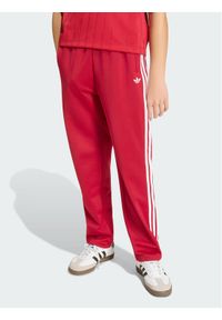 Adidas - adidas Spodnie dresowe Firebird HZ6651 Czerwony Regular Fit. Kolor: czerwony. Materiał: syntetyk #1