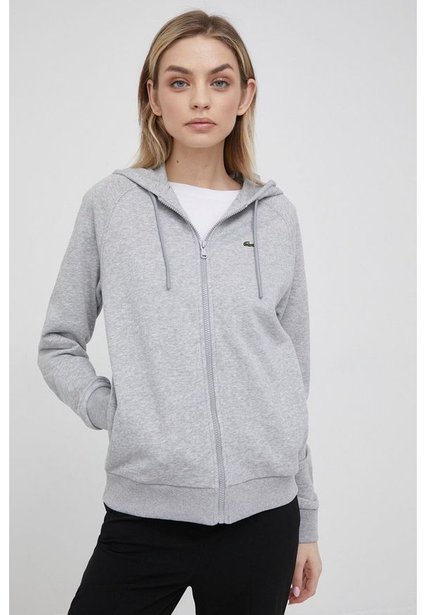 Lacoste bluza damska kolor czarny z kapturem gładka. Okazja: na co dzień. Typ kołnierza: kaptur. Kolor: szary. Długość rękawa: raglanowy rękaw. Wzór: gładki. Styl: casual