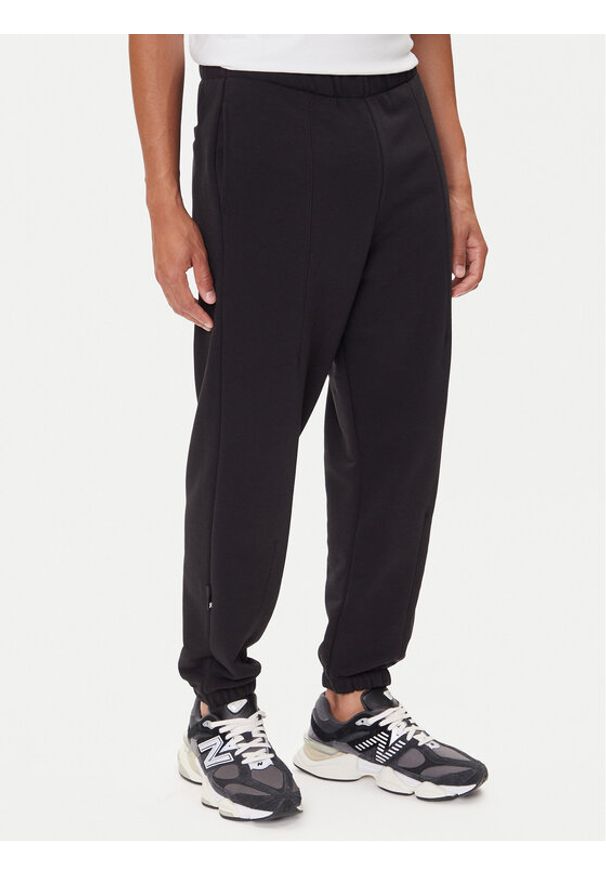 On Spodnie dresowe Club Pants 1ME1004 Czarny Relaxed Fit. Kolor: czarny. Materiał: bawełna