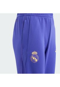 Adidas - Spodnie Real Madrid Tiro 23 Training Kids. Kolor: czarny, fioletowy, wielokolorowy. Materiał: materiał. Sport: piłka nożna