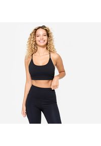 Decathlon - Stanik sportowy Domyos prążkowany. Kolor: czarny. Materiał: prążkowany. Sport: joga i pilates, fitness