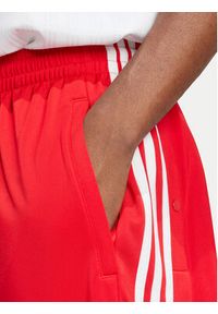 Adidas - adidas Spodnie dresowe Adibreak IY9924 Czerwony Loose Fit. Kolor: czerwony. Materiał: syntetyk