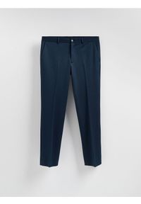 Reserved - Garniturowe spodnie slim fit - granatowy. Kolor: niebieski. Materiał: dzianina #1