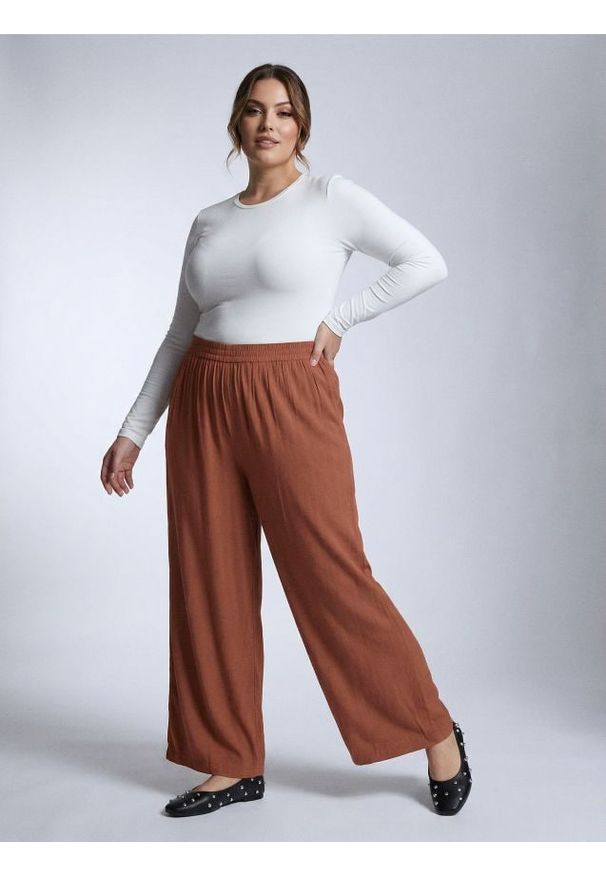 Sinsay - Wiskozowe spodnie wide leg Plus Size - żółty. Kolekcja: plus size. Kolor: żółty