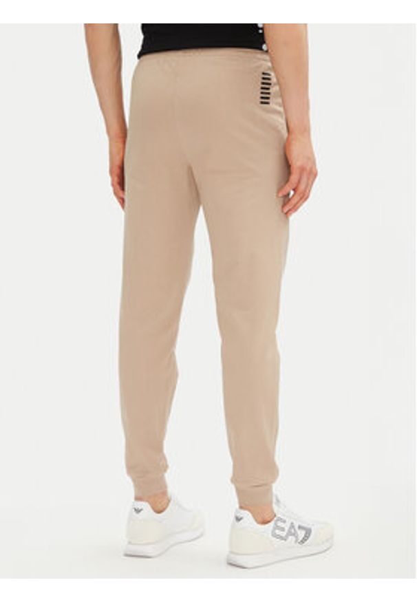 EA7 Emporio Armani Spodnie dresowe 8NPP66 PJVRZ U6155 Beżowy Slim Fit. Kolor: beżowy. Materiał: bawełna