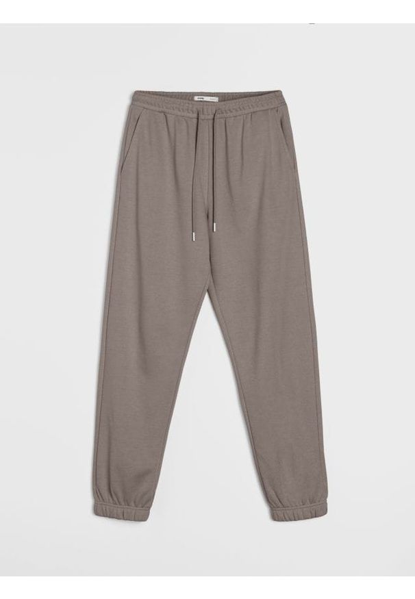 Sinsay - Dresowe spodnie jogger terry - brązowy. Kolor: brązowy. Materiał: dresówka