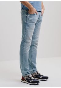 Ochnik - Niebieskie spodnie jeansowe męskie. Kolor: niebieski. Materiał: bawełna #1
