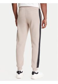 Guess Spodnie dresowe Z2YB09 KB3P2 Beżowy Regular Fit. Kolor: beżowy. Materiał: bawełna