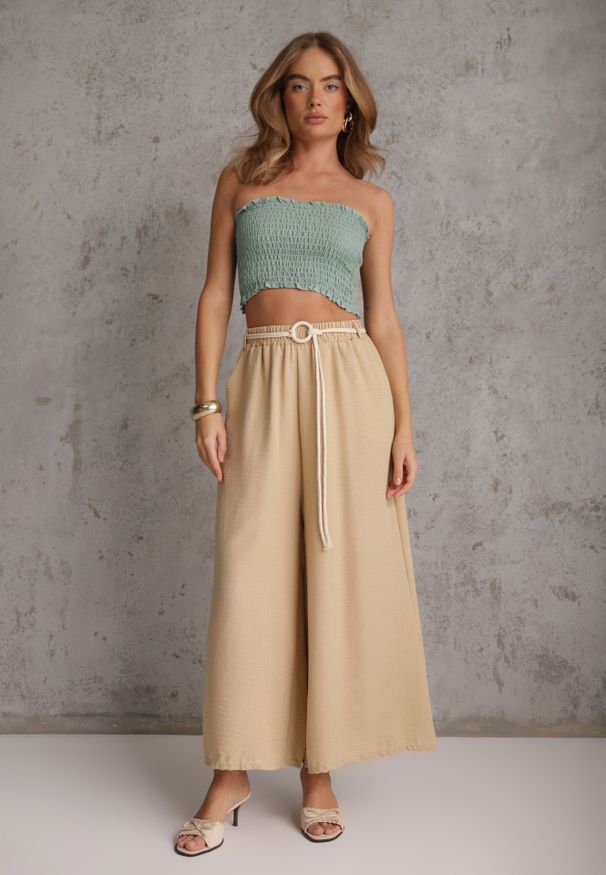 Renee - Beżowe Wiskozowe Spodnie Typu Palazzo High Waist Ozdobione Paskiem Sznurkiem Alemea. Okazja: na co dzień. Stan: podwyższony. Kolor: beżowy. Materiał: wiskoza. Długość: krótkie. Wzór: aplikacja. Styl: casual, boho