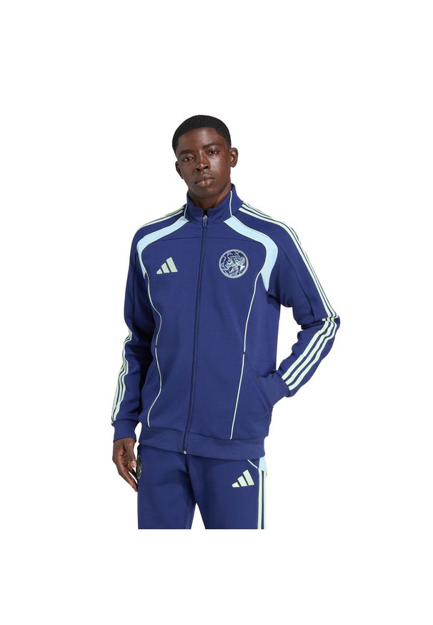 Adidas - Kurtka dresowa Ajax Amsterdam UBP Doubleknit 2025/26. Kolor: niebieski. Materiał: dresówka. Sport: piłka nożna
