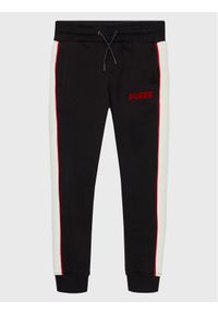Guess Spodnie dresowe L2BQ19 KBGQ2 Czarny Regular Fit. Kolor: czarny. Materiał: bawełna
