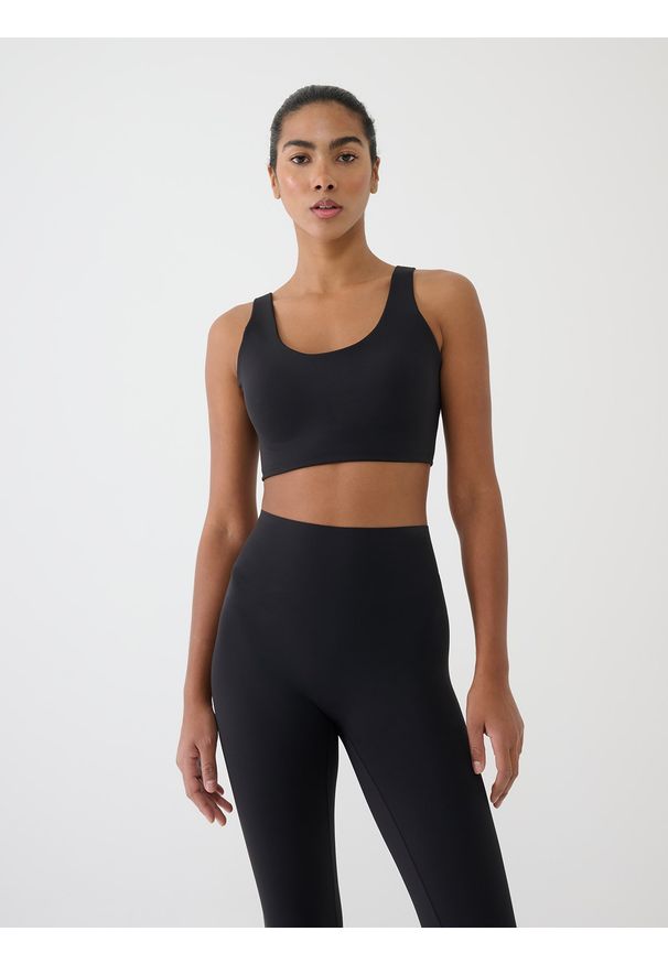 4f - 4F Biustonosz treningowy ze średnim wsparciem - czarny M. Kolor: czarny. Materiał: dzianina, elastan, włókno, syntetyk, materiał, guma. Wzór: gładki, jednolity, ze splotem. Sport: fitness, bieganie, kolarstwo