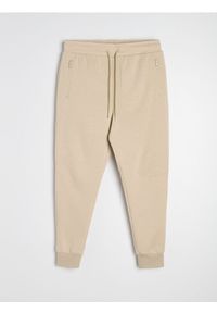 Sinsay - Spodnie dresowe jogger - beżowy. Kolor: beżowy. Materiał: dresówka #1