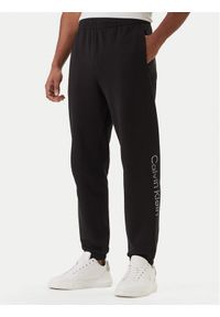 Calvin Klein Spodnie dresowe Eu Sportswear Graphic LV04LF236G Czarny Regular Fit. Kolor: czarny. Materiał: bawełna #1