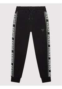 Guess Spodnie dresowe L2YQ48 K6ZS1 Czarny Regular Fit. Kolor: czarny. Materiał: bawełna #1