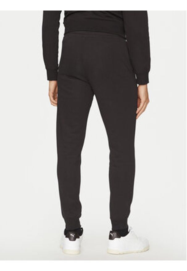Puma Spodnie dresowe Ess No. 1 Logo 682608 Czarny Regular Fit. Kolor: czarny. Materiał: bawełna, syntetyk