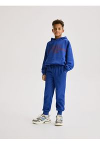 Reserved - Bawełniane spodnie jogger - niebieski. Kolor: niebieski. Materiał: bawełna