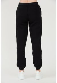 Guess - GUESS Czarne damskie spodnie dresowe Kiara Pant, Rozmiar S. Kolor: czarny. Materiał: dresówka