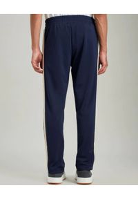 PALM ANGELS - Granatowe spodnie dresowe. Kolor: niebieski. Materiał: dresówka #3