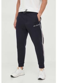 Armani Exchange spodnie dresowe kolor granatowy z aplikacją. Kolor: niebieski. Materiał: dresówka. Wzór: aplikacja #1