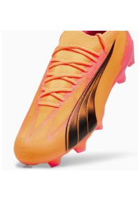 Buty piłkarskie Puma Ultra Ultimate M 107744-03 pomarańczowe. Zapięcie: sznurówki. Kolor: pomarańczowy. Materiał: syntetyk. Szerokość cholewki: normalna. Sport: piłka nożna