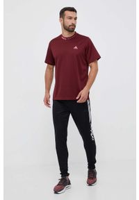 Adidas - adidas spodnie dresowe kolor czarny z nadrukiem. Kolor: czarny. Materiał: dresówka. Wzór: nadruk #4