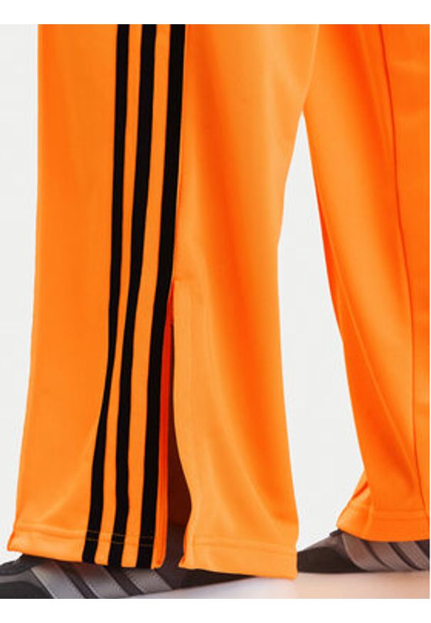 Adidas - adidas Spodnie dresowe adicolor Classic Firebird JY2694 Żółty Loose Fit. Kolor: żółty. Materiał: syntetyk
