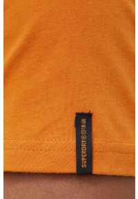 Superdry T-shirt bawełniany kolor pomarańczowy z nadrukiem. Okazja: na co dzień. Kolor: pomarańczowy. Materiał: bawełna. Wzór: nadruk. Styl: casual