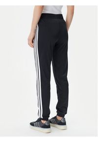 Adidas - adidas Spodnie dresowe Tricot 3-Stripes JF3383 Czarny Regular Fit. Kolor: czarny. Materiał: syntetyk