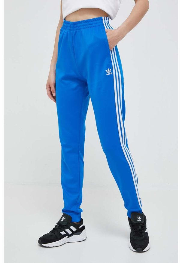 adidas Originals spodnie dresowe kolor niebieski z aplikacją. Kolor: niebieski. Materiał: dresówka. Wzór: aplikacja