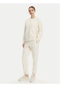DKNY Sport Spodnie dresowe DP5P3585 Beżowy Regular Fit. Kolor: beżowy. Materiał: syntetyk