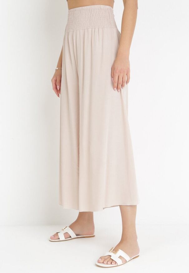 Born2be - Jasnobeżowe Szerokie Spodnie z Wiskozy o Długości 7/8 Inule. Stan: podwyższony. Kolor: beżowy. Materiał: wiskoza