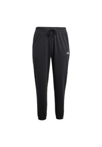 Adidas - Spodnie Essentials 3-Stripes French Terry Cuffed. Kolor: czarny, biały, wielokolorowy. Materiał: materiał. Sport: fitness