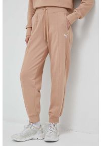 Puma spodnie dresowe kolor beżowy gładkie. Stan: podwyższony. Kolor: beżowy. Materiał: dresówka. Wzór: gładki #4
