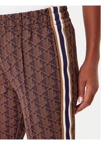 Lacoste Spodnie dresowe XF9313 Brązowy Regular Fit. Kolor: brązowy. Materiał: bawełna