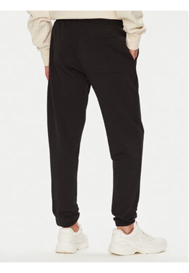 Tommy Jeans Spodnie dresowe Dna Graphic DM0DM22145 Czarny Slim Fit. Kolor: czarny. Materiał: bawełna