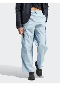 Adidas - adidas Spodnie dresowe City Escape Cargo HZ2874 Niebieski Loose Fit. Kolor: niebieski. Materiał: syntetyk