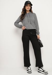 Born2be - Czarne Szerokie Spodnie ze Sznurowaniem Esadriel. Okazja: na co dzień. Kolor: czarny. Styl: elegancki, casual